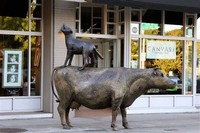 Cow And Coyote Statue