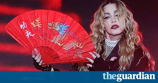 Madonna pulls down fan's top onstage in Brisbane in ...