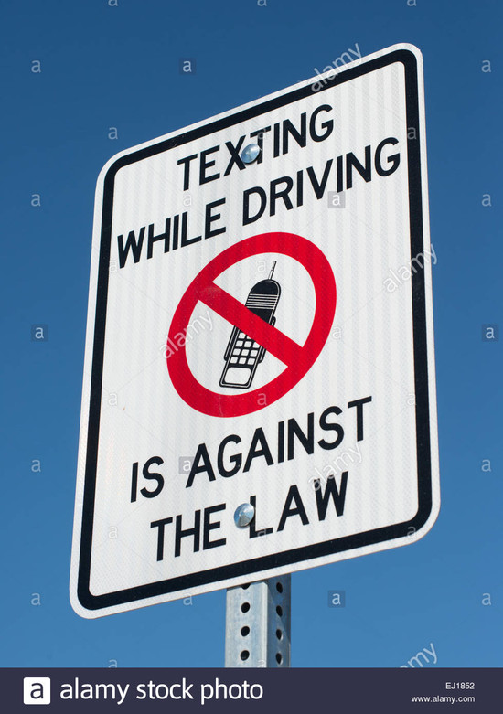 A Sign Warning Drivers Texting While Driving is Against ...