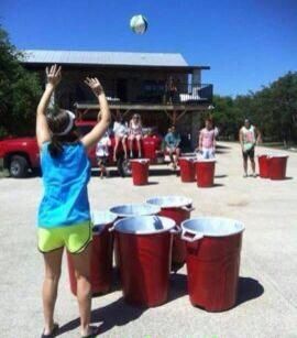 Super beer pong! Trash cans as red solo cups and a ...